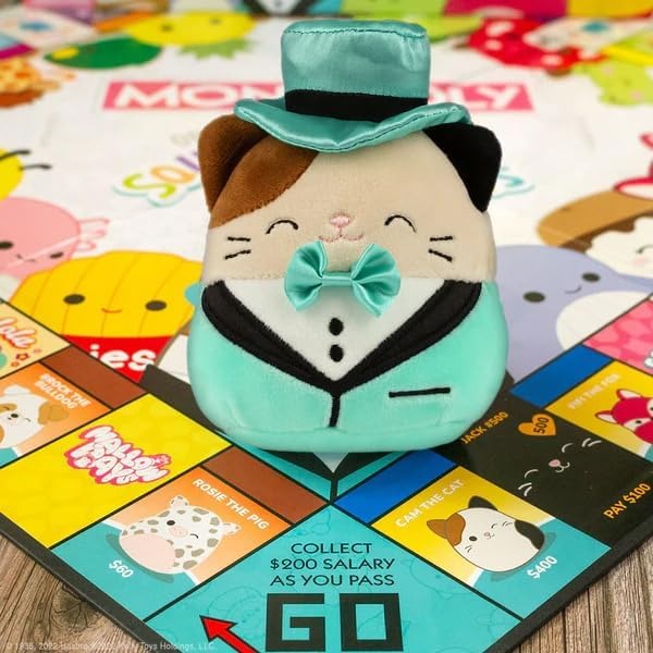 Winning Moves Squishmallows Monopoly Board Game Collectors Edition, Play with Fifi the Fox, Rosie the pig and Brock the Bulldog, includes an exclusive 4" Cam the Cat plush, great gift for ages 8+